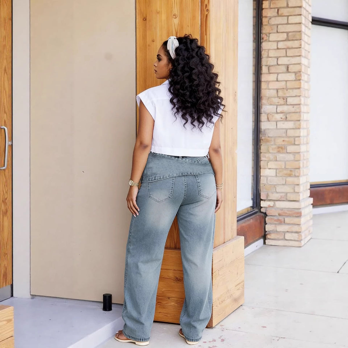 Eprolo street style distressed denim pants with multiple pockets, belt, and washed finish, showcasing a relaxed, edgy look.