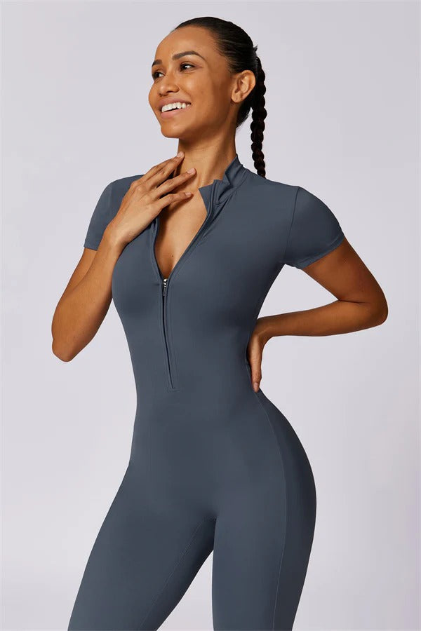 Black Mia Belle jumpsuit by Fitglutes Activewear, showing a fitted athletic jumpsuit with shoulder straps and sporty design.