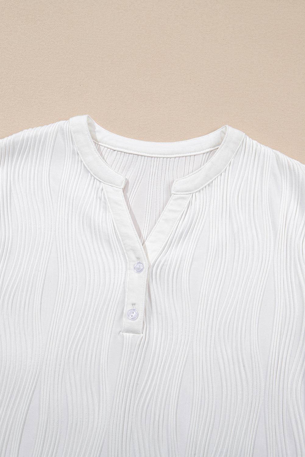 Wavy textured Raina tee from Threaded Pear featuring a relaxed fit and soft fabric, styled on a model.