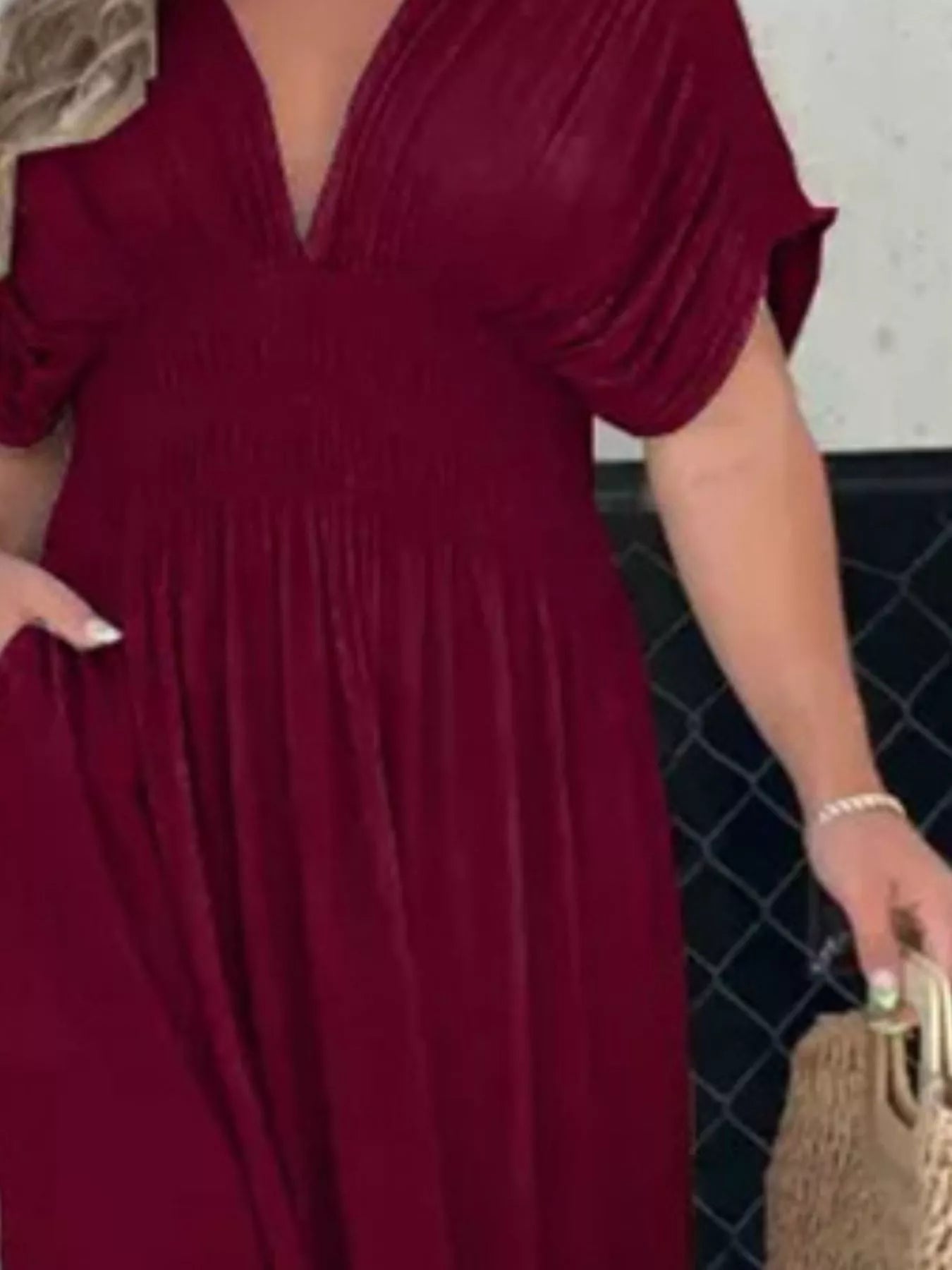 Plus size maxi dress with slit, V-neck, and smocked waist from Trendsi, featuring a flowing silhouette and elegant design.