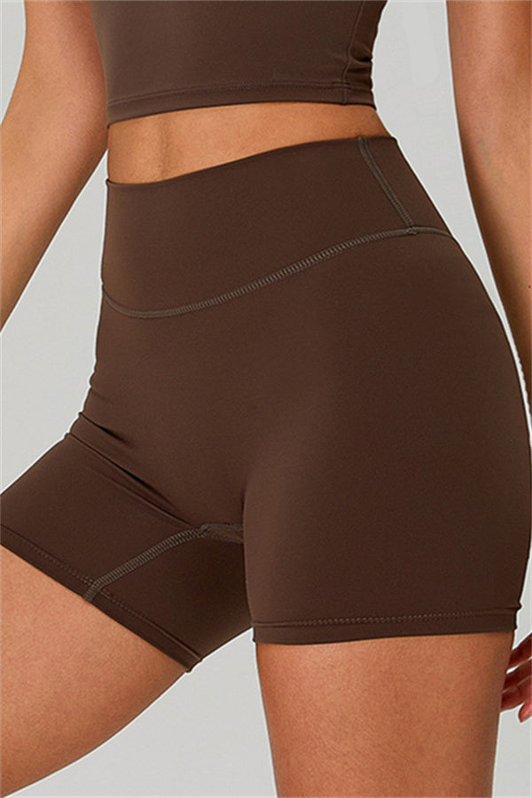 Fitglutes activewear one-shoulder crop top and shorts 2-piece set, ideal for gym and workout activities.