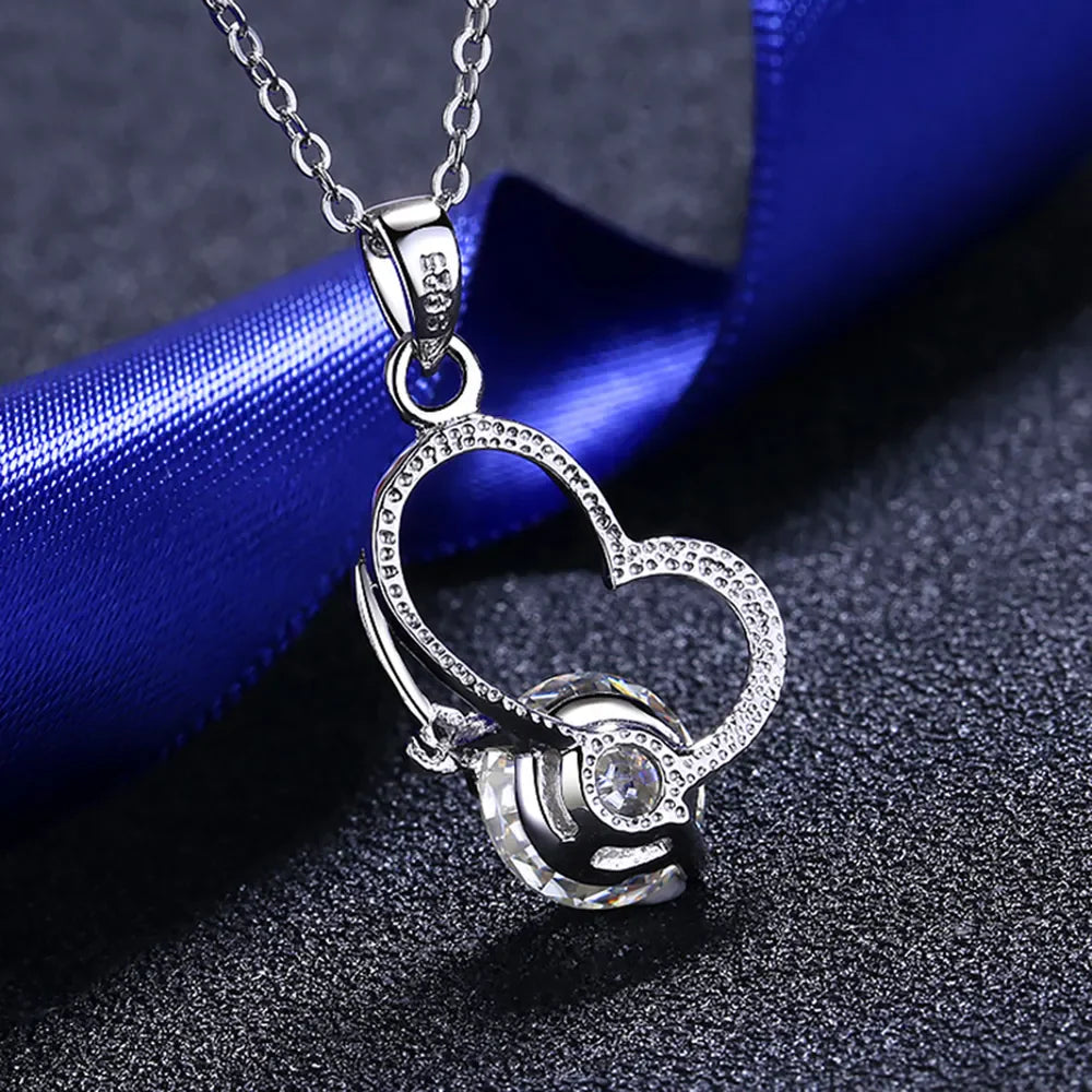 Sterling silver 2 carat moissanite heart necklace with pendant, elegant jewelry from Plush Fashion Hub.