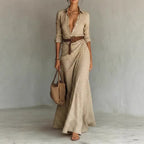 Women's belted irregular pleated dress by Plush Fashion Hub, featuring a stylish flowy design and waist belt detail.