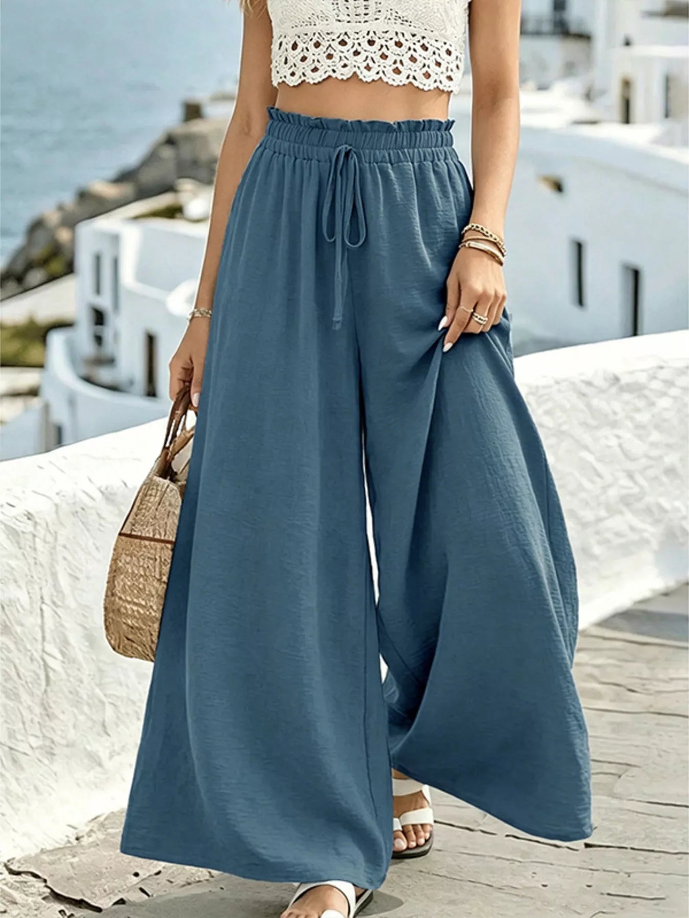 Wide leg drawstring pants by Plush Fashion Hub, featuring a relaxed fit and comfortable waistband, shown in a stylish product image.