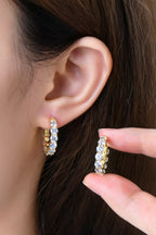 Sterling silver earrings with 7.2 carat moissanite gemstones, elegant jewelry piece with a shiny, faceted stone design.