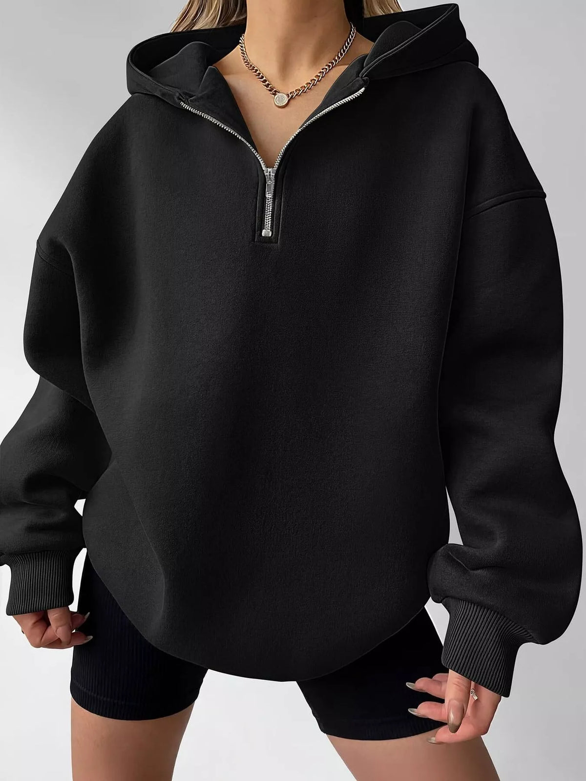 Gray oversized quarter-zip hoodie from Trendsi, featuring a relaxed fit and soft fabric, perfect for casual wear.