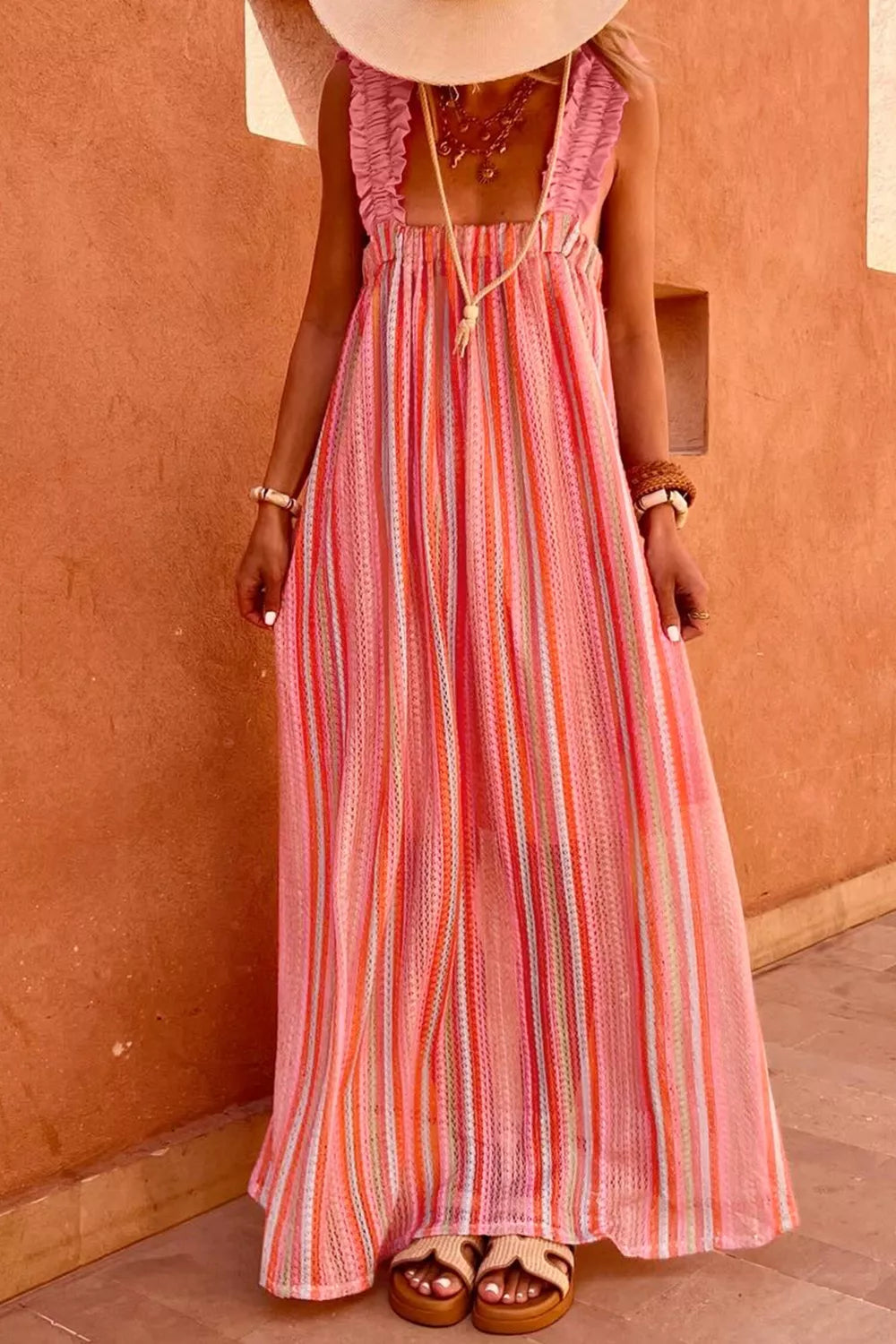 Flowy plush fashion hub maxi dress with stripe ruffled straps, ribbon knot details, perfect for vacation wear.