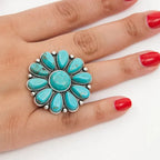 Artificial turquoise alloy flower ring with intricate floral design, featuring vibrant turquoise stones and silver-toned alloy band.