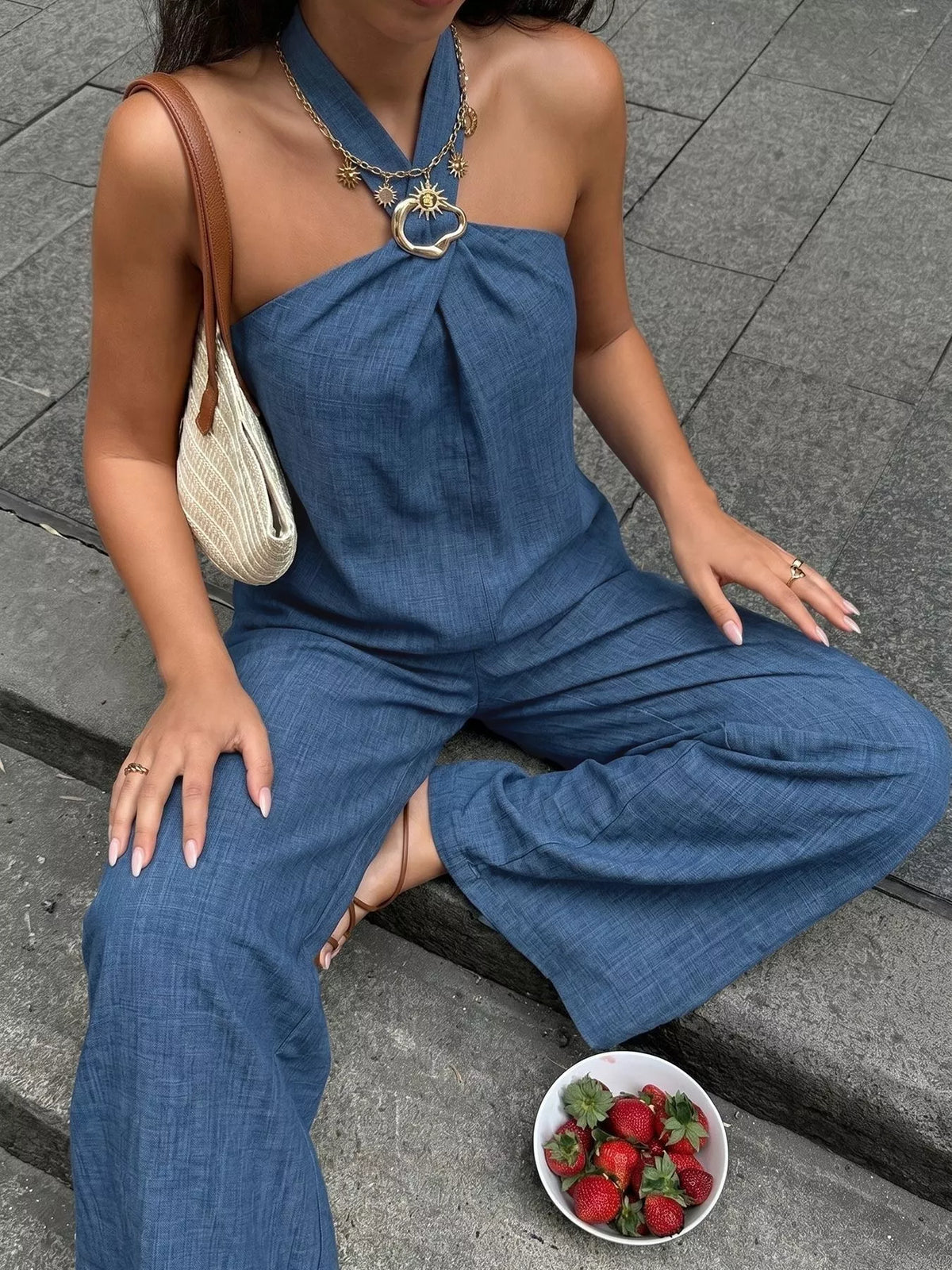 Plush Fashion Hub two-piece set featuring a halter neck top and wide-leg pants, styled for a trendy, relaxed look.