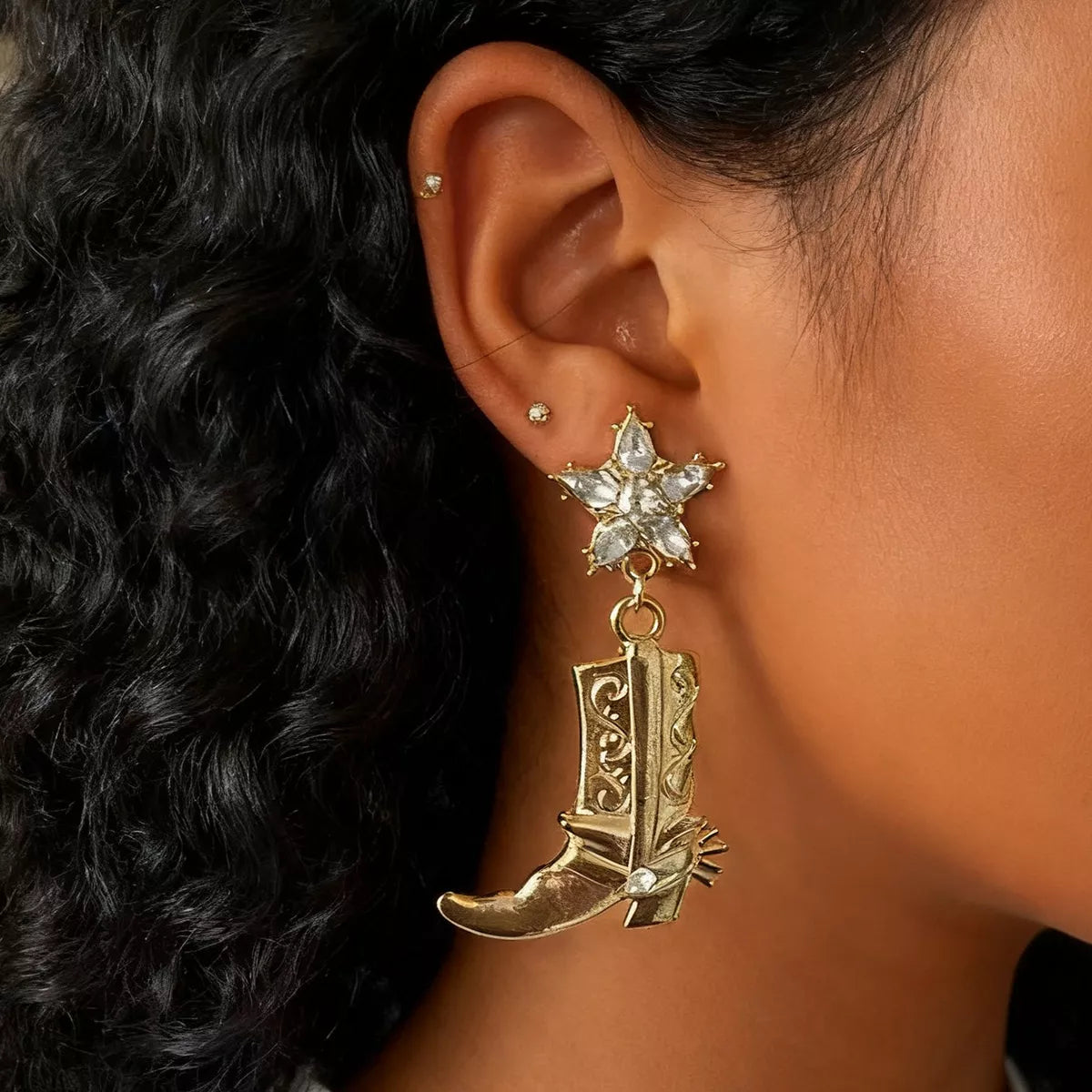 Western style dangle earrings with cowboy boot design, featuring silver accents and intricate details, by Shopimist.
