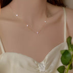 Sterling silver clover charm necklace with delicate chain, featuring a four-leaf clover pendant, crafted by Shopimist.