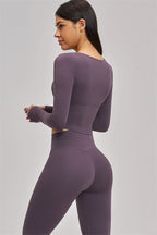 Fitglutes Activewear long sleeve crop top with fitted design and breathable fabric, ideal for gym workouts and sportswear.