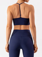 Trendsi spaghetti strap active bra in black, lightweight sports bra with thin shoulder straps and seamless design for active wear.