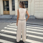 Women's contrast color sleeveless vest and drawstring trousers suit by FitiqueFit, shown in four different color options.