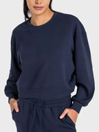 Millennia round neck drop shoulder sports top by Trendsi, featuring a relaxed fit and sporty design.