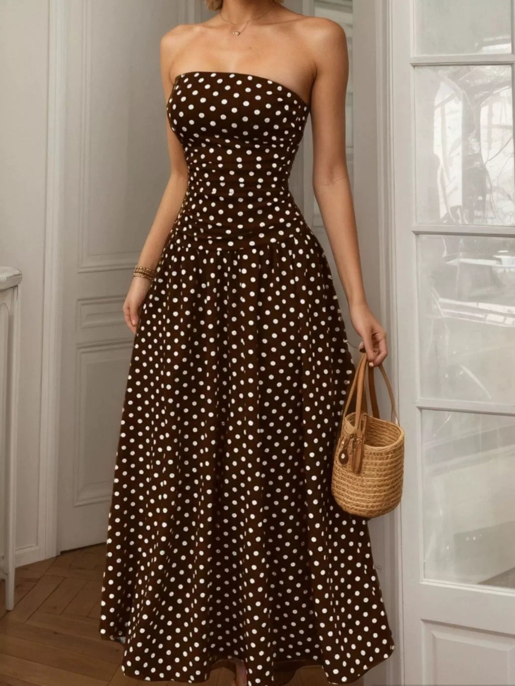 Polka dot strapless maxi dress by Shopimist featuring a flowy silhouette and bold black and white pattern.