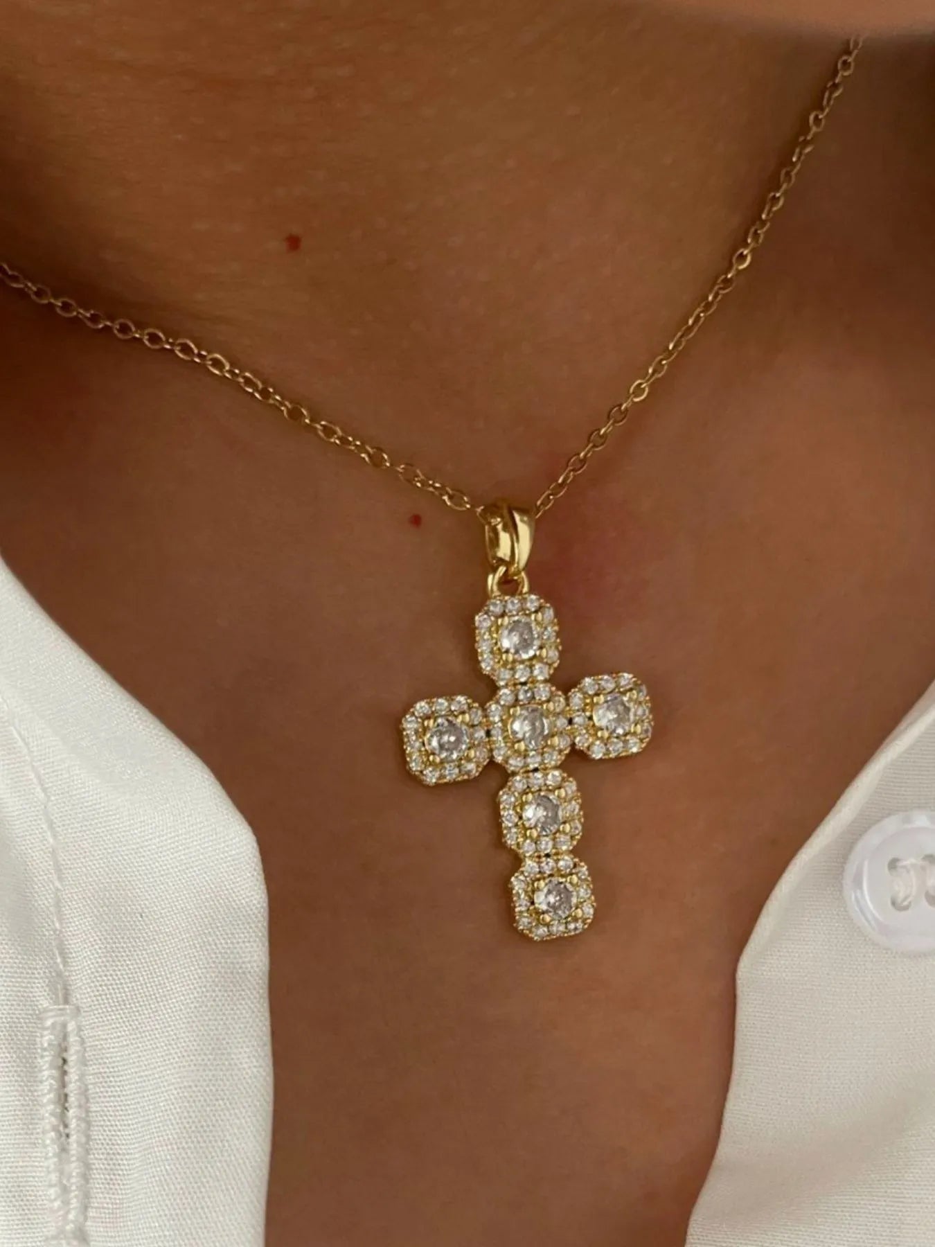 Stainless steel cross necklace with inlaid zircon stones, jewelry from Plush Fashion Hub featuring a sleek and elegant design.