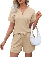 Solid color short sleeve top and shorts two-piece set by Trendsi, casual summer outfit, lightweight fabric, comfortable fit.