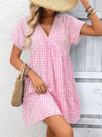 Plush Fashion Hub chic plaid v-neck mini dress with ruffle hem, lightweight and perfect for seasonal fashion.