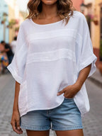 Loose-fitting LadyShow.Store top with crew neck and three-quarter sleeves, shown in a casual, relaxed fit.