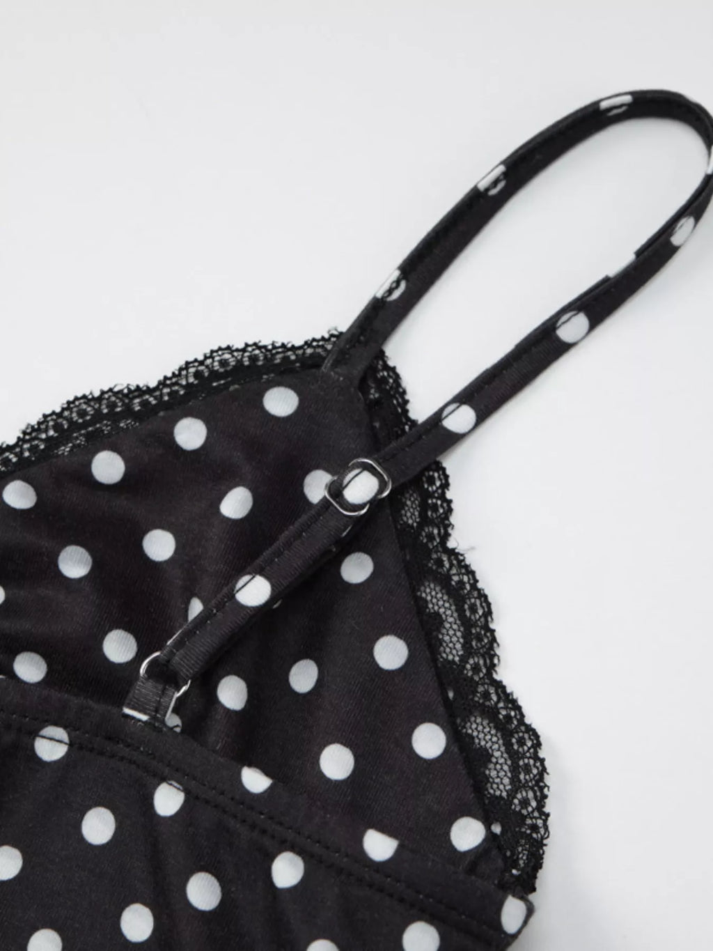 Polka dot lace trim cami top by Shopimist featuring a delicate lace neckline and polka dot fabric in a casual sleeveless design.