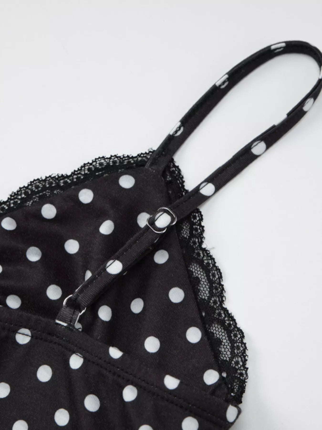 Polka dot lace trim cami top by Shopimist featuring a delicate lace neckline and polka dot fabric in a casual sleeveless design.