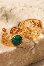 18k gold plated malachite leaf ring with intricate leaf design and vibrant green stone, elegant jewelry piece.