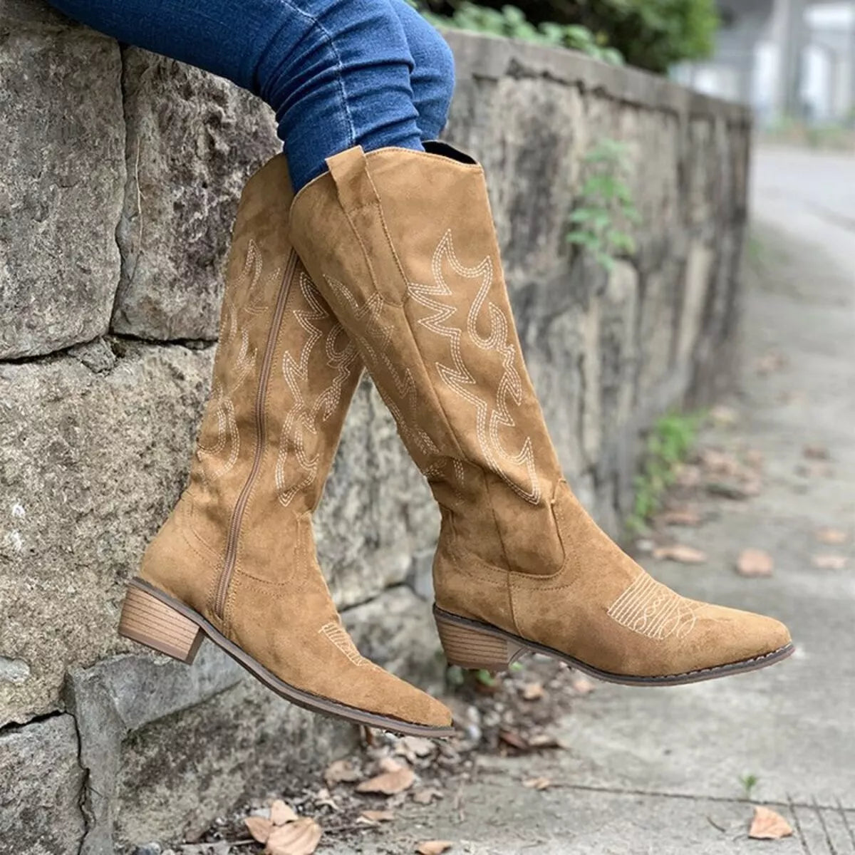 Point toe block heel boots from Trendsi featuring sleek black leather uppers and sturdy block heels for stylish footwear.