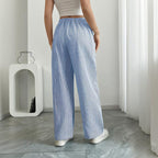Women's striped print wide-leg casual pants with pockets by FitiqueFit, featuring a straight fit and comfortable long style.