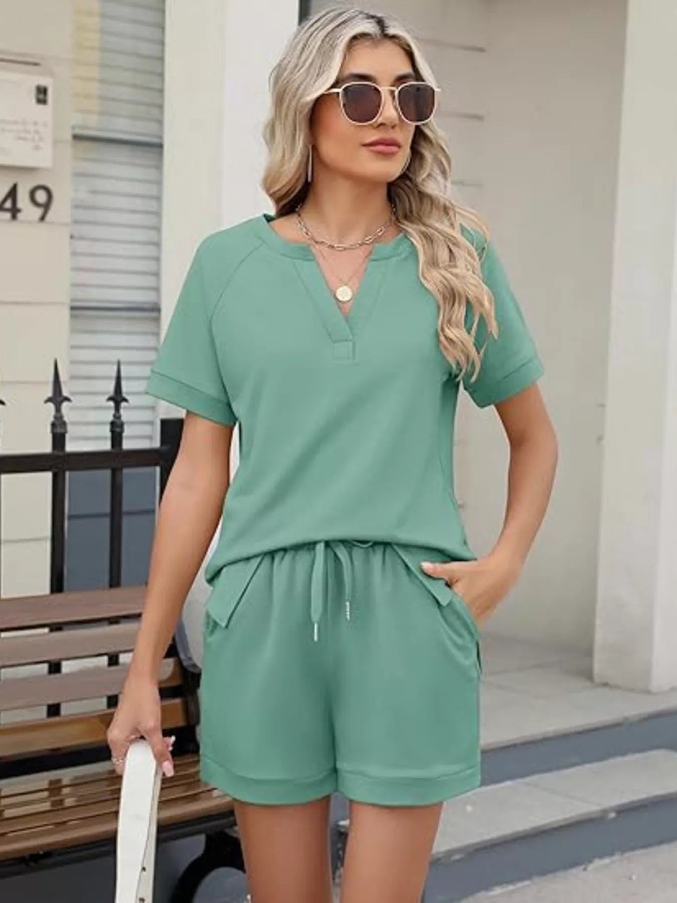 Solid color short sleeve top and matching shorts two-piece set from Trendsi, casual and comfortable summer outfit.