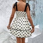 Elegant summer casualwear dress by FitiqueFit featuring shoulder strap bow decoration and bow print design.