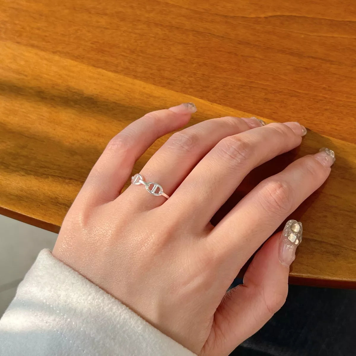 Sterling silver geometric ring with modern angular design, crafted by Shopimist, showcasing a sleek and contemporary jewelry piece.
