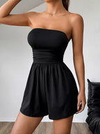 Chic strapless romper with ruched waist design, featuring a trendy style perfect for summer and casual occasions.
