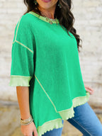 Women's ribbed twist hem short sleeve T-shirt with contrast stitching, featuring a fitted design and stylish details.