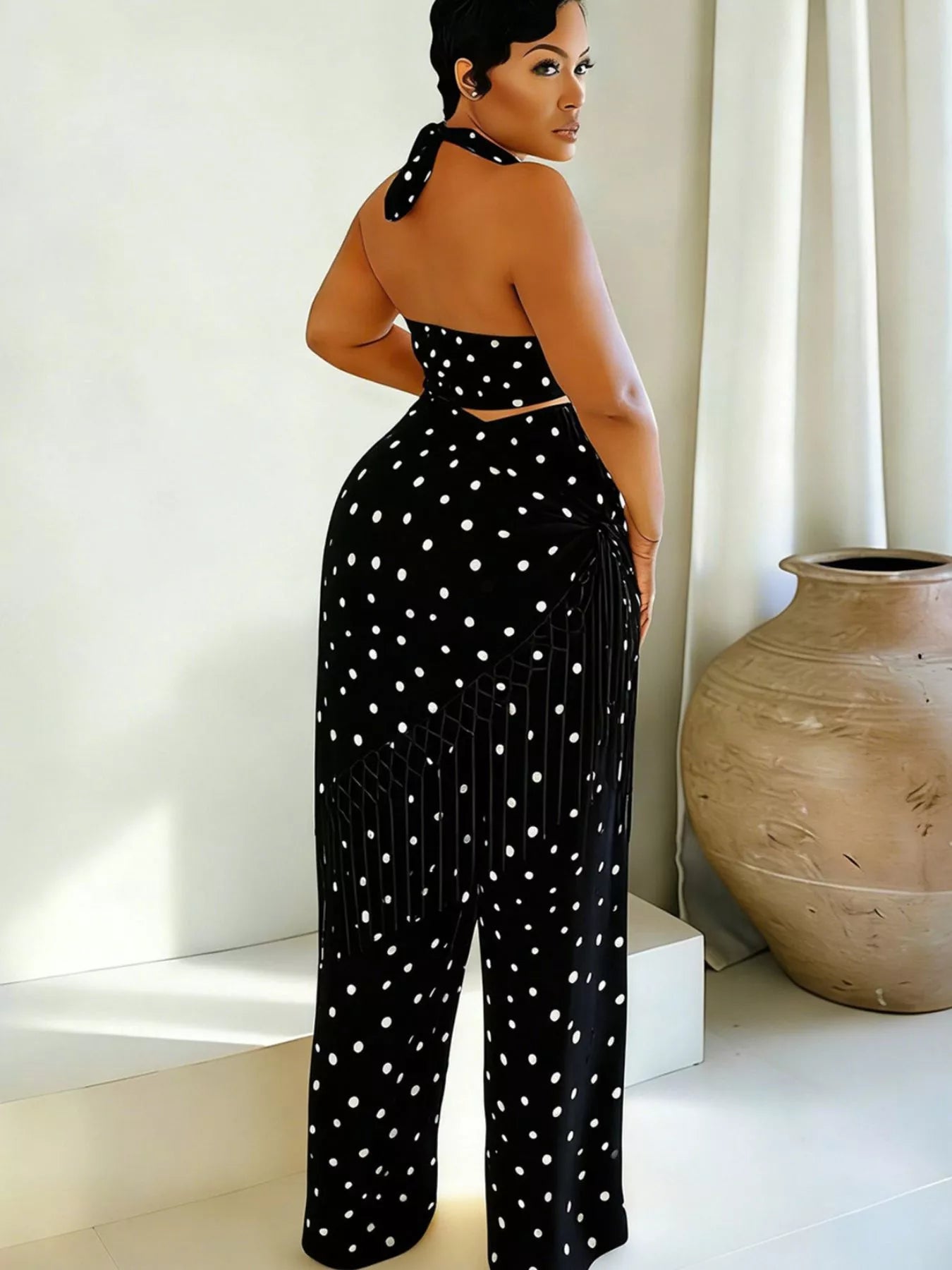 Polka dot halter neck cami and fringe trim pants set with rings, trendy fashion by Trendsi, styled on a model.