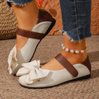 Women's chic bow round toe slip-on flats made of vegan leather, stylish and comfortable shoes by Trendsi.
