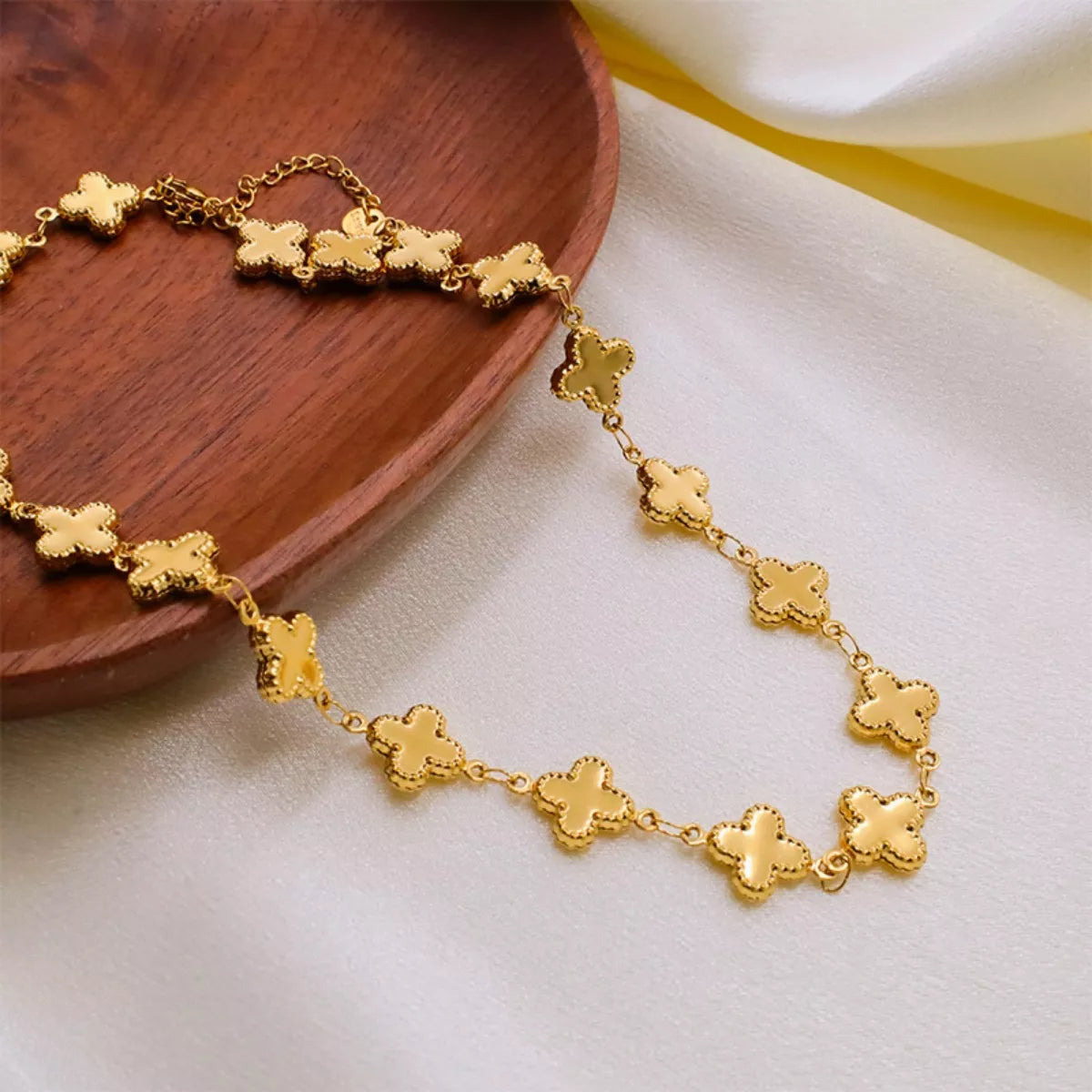 Gold-plated Clover Charm Necklace with delicate chain, featuring a four-leaf clover pendant, from Shopimist.