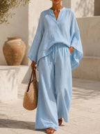 Plus size Trendsi loungewear set with notched long sleeve top and wide-leg pants, comfortable and stylish for relaxed wear.