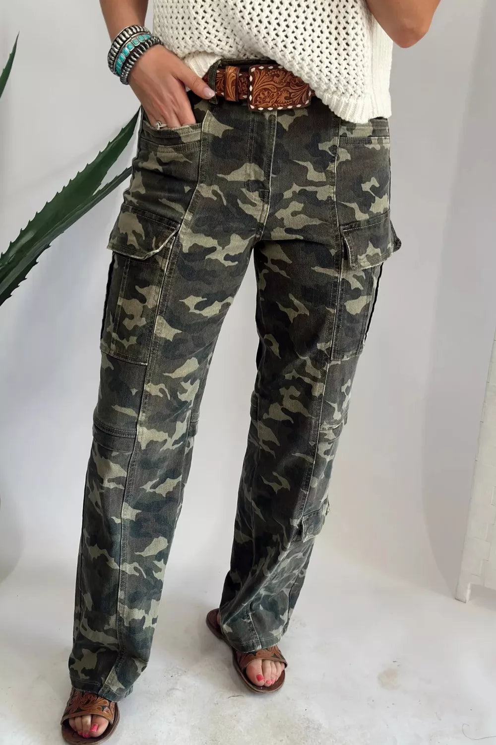 Camouflage print women's denim pants with multiple pockets and a relaxed fit, made by Shopimist.