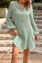 Devine Notched Balloon Sleeve Cotton Mini Dress by Trendsi, featuring a stylish mini dress with balloon sleeves and notch details.