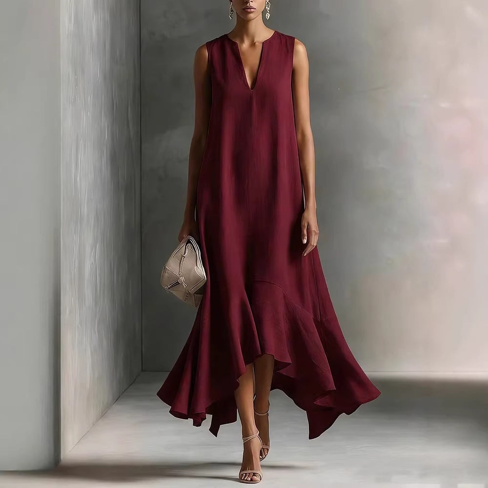 Women's deep V-neck sleeveless asymmetrical maxi dress with patchwork design by FitiqueFit, featuring flowing fabric and unique hemline.