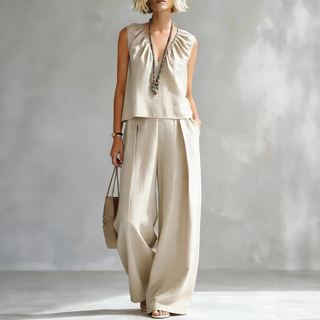 Women's sleeveless cotton-linen shirt and pants set by FitiqueFit, casual urban 2-piece outfit shown in natural fabric and relaxed fit.