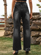 Distressed denim jeans with front and back pockets from Plush Fashion Shop, showcasing a trendy, ripped style and classic fit.