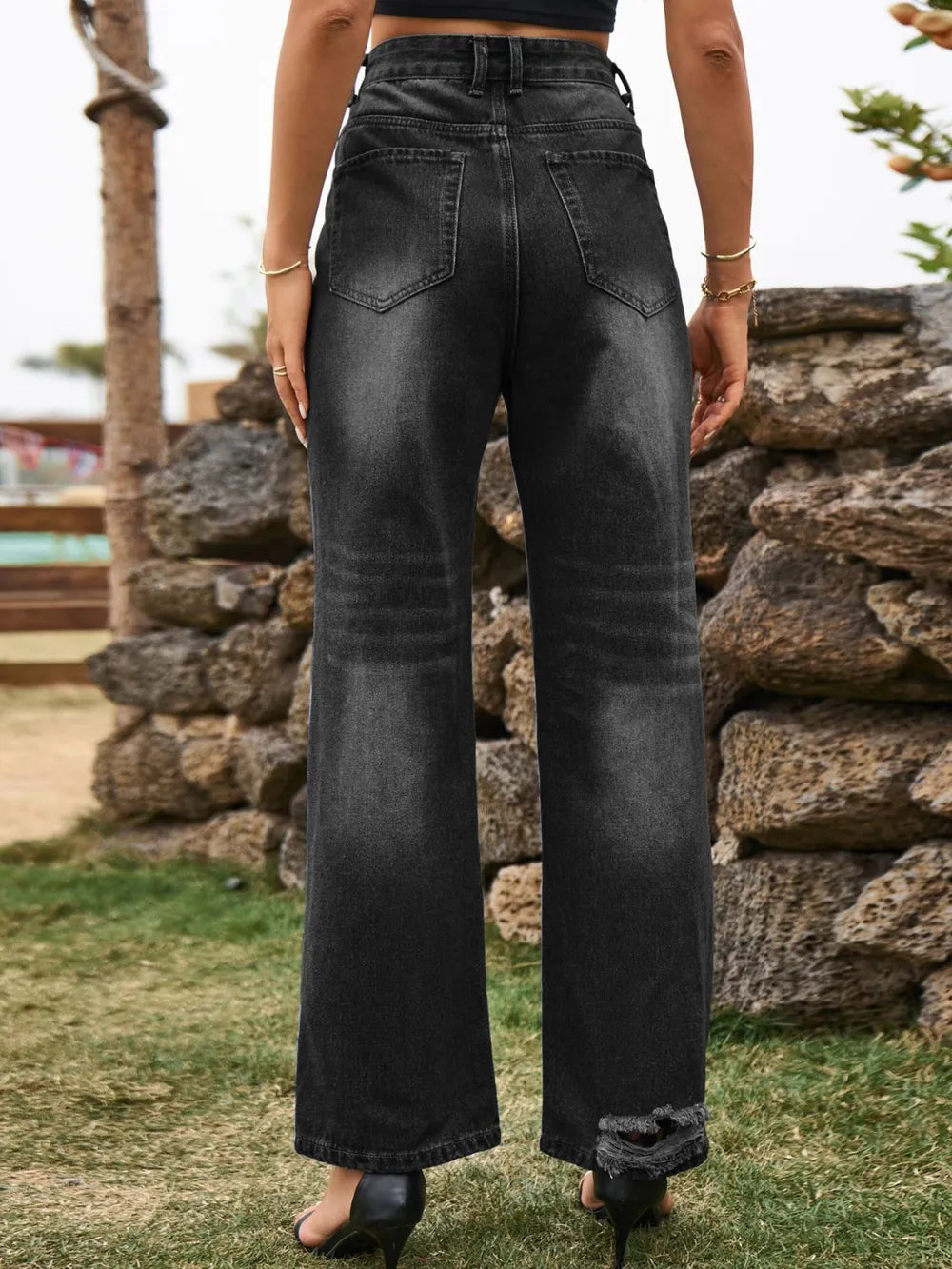 Distressed denim jeans with front and back pockets from Plush Fashion Shop, showcasing a trendy, ripped style and classic fit.
