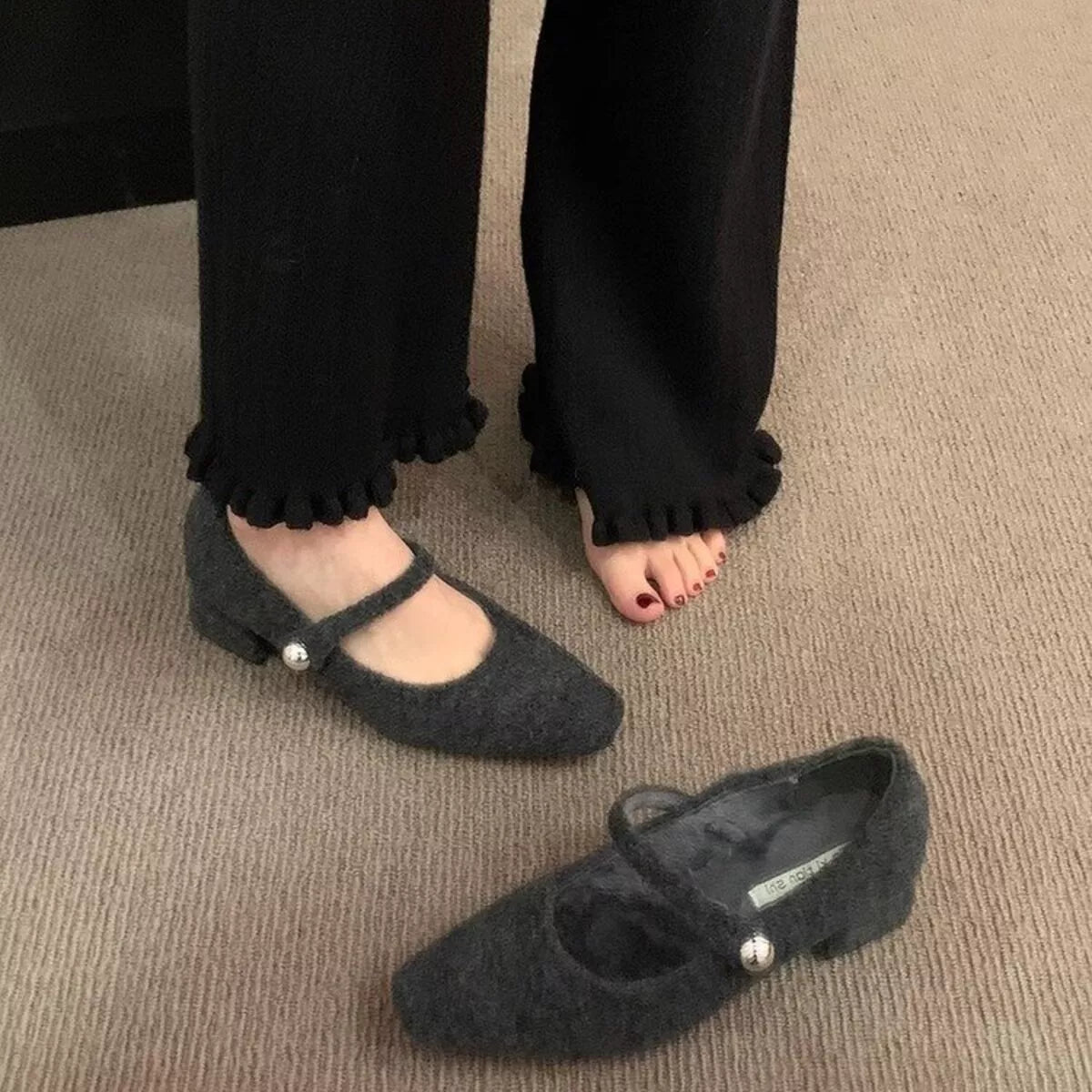 Elegant black block heel loafers by Trendsi, showcasing a stylish shoe with a sleek design and comfortable chunky heel.