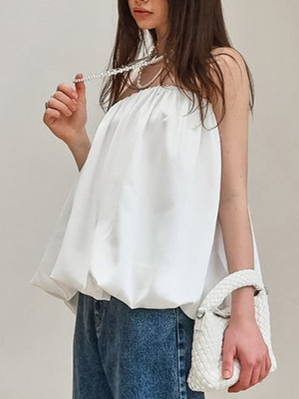 Women's strapless bubble hem tube top by Plush Fashion Hub, featuring a sleek, minimalist crop top design with a fitted silhouette.
