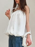 Women's strapless bubble hem tube top by Plush Fashion Hub, featuring a sleek, minimalist crop top design with a fitted silhouette.