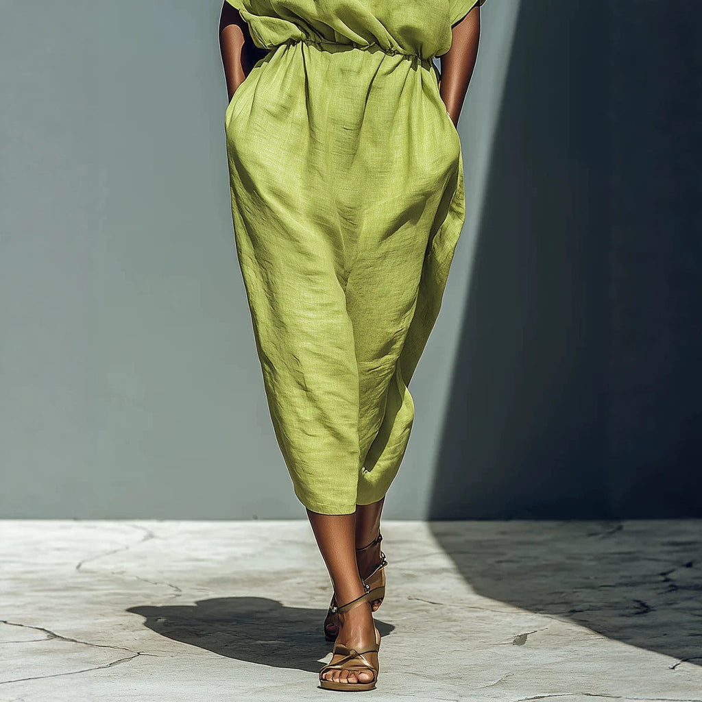Women's Batwing Sleeve Off-Shoulder Maxi Dress by FitiqueFit, featuring elastic waist and flowing fabric in a stylish design.