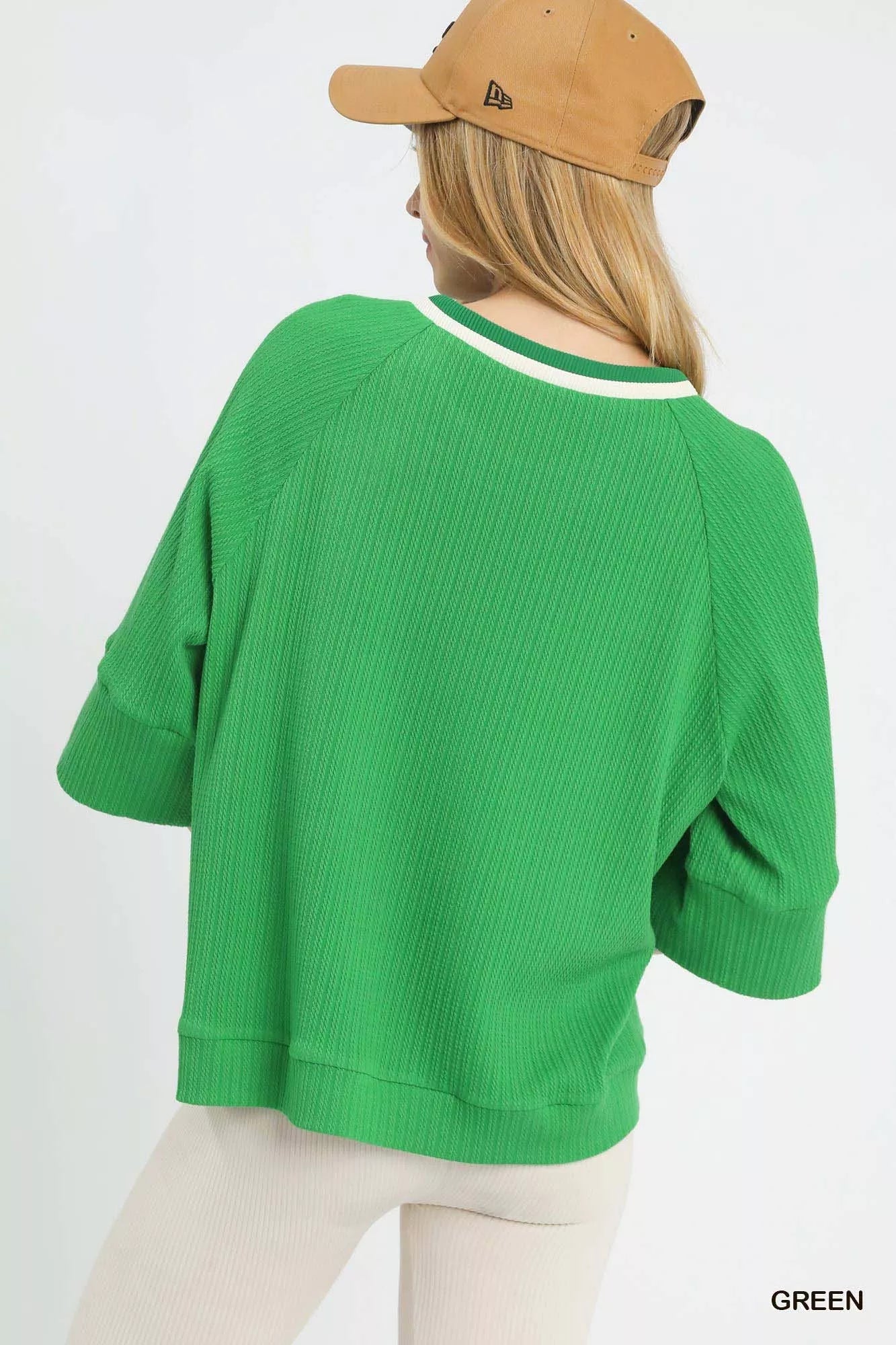 Umgee ribbed knit top with contrast trim, featuring long sleeves and a fitted silhouette, perfect for casual wear.