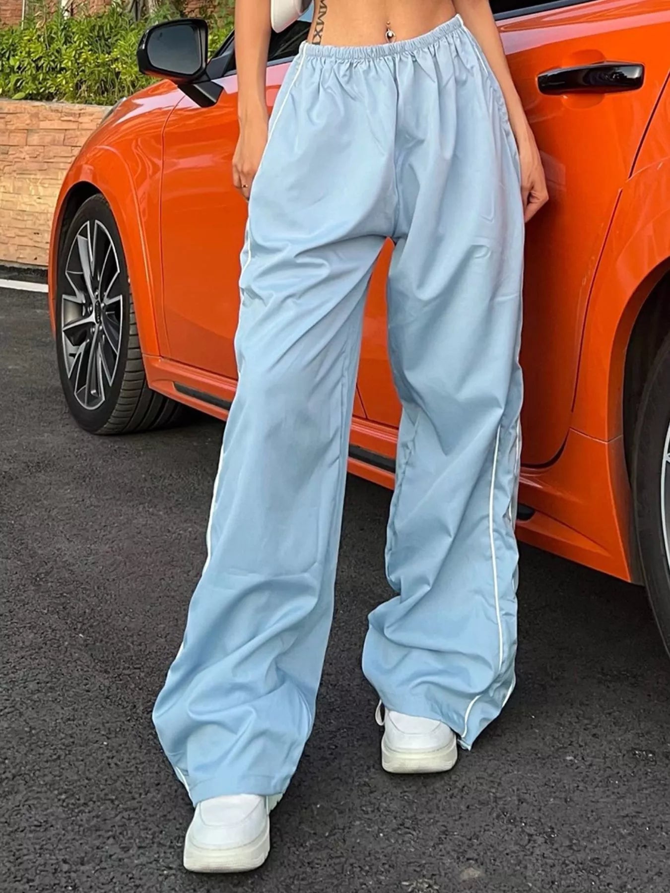 Women's high-rise wide-leg dress pants from Trendsi featuring lightweight fabric and an elastic waist for a comfortable fit.